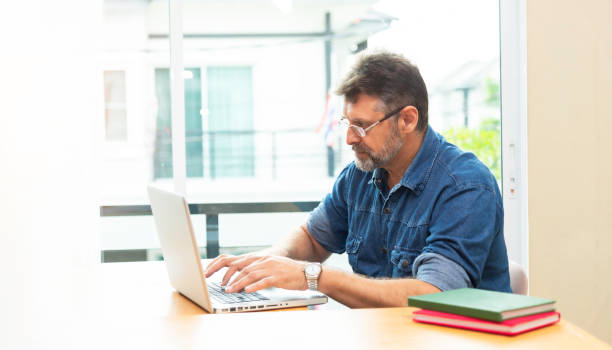 Architect working at his laptop on the office