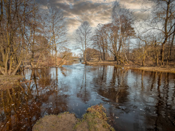 istock A small river in the light of the setting sun, Poland. 2095834422