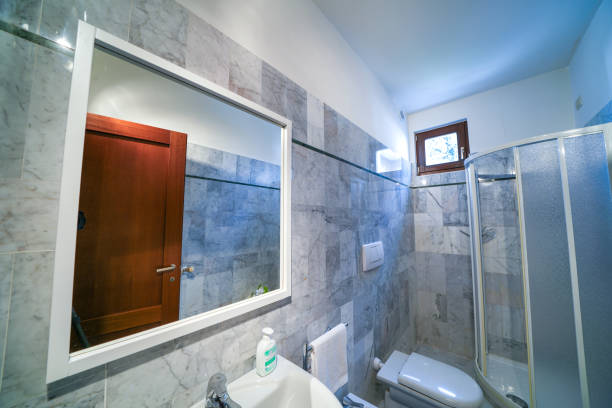 istock Morning in a bright and sunny modern grey bathroom interior 2095841859