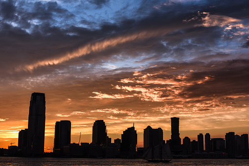 Beautiful dusk skies over Jersey City seen from the Battery Park in New York City.