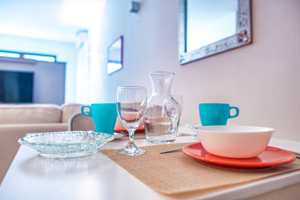 Red cups neatly arranged on the hotel terrace table, adding a vibrant and elegant touch to the setting.
