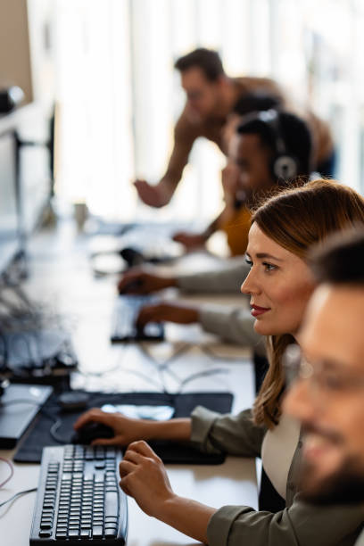 istock support call center, a multi ethnic people computers headsets assisting customers 2095867878