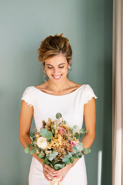 istock Bride to be married with bouquet of flowers 2095880986