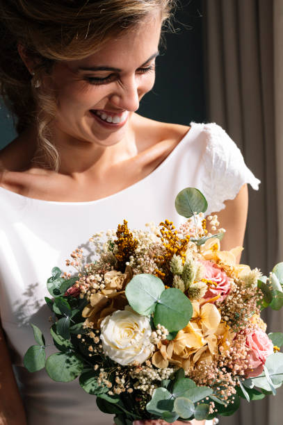 istock Bride to be married with bouquet of flowers 2095881005