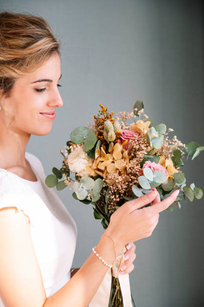 istock Bride to be married with bouquet of flowers 2095882041