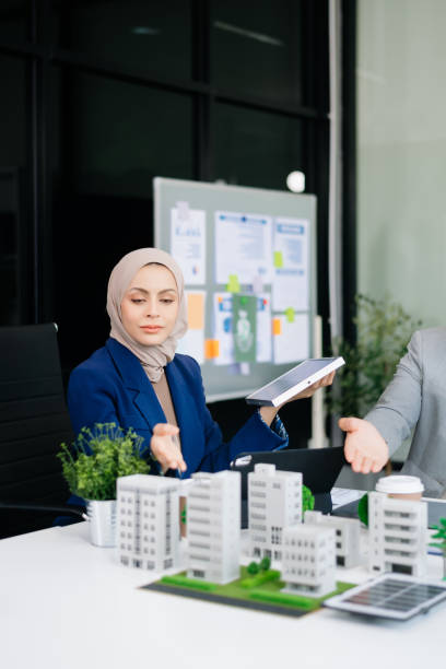 business people having consultation about wind energy at company office. business team discussing about windmill and alternative green enery. net zero and carbon neutral concept - 5428 뉴스 사진 이미지