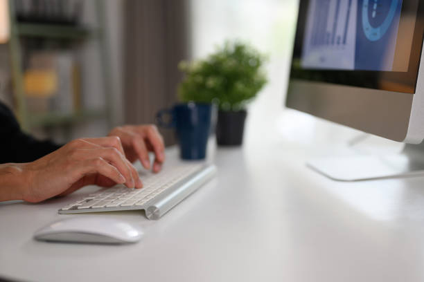 istock Businessman typing on computer keyboard working on online project or chatting with client 2095930240