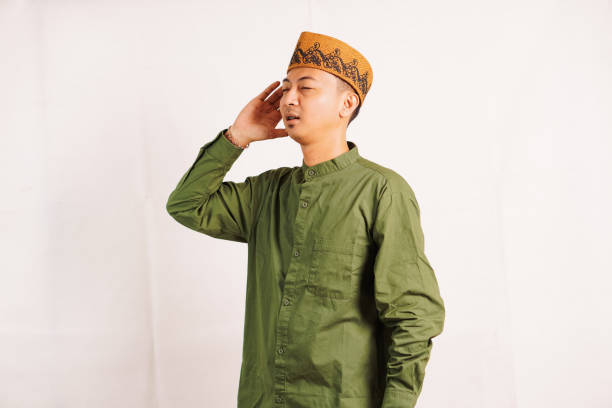 Muslim reads in the ear azan