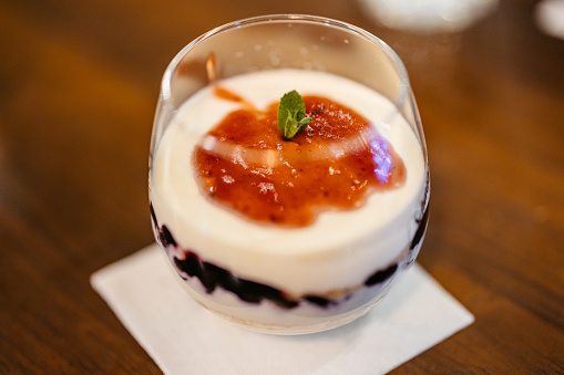 A strawberry dessert on the table in a pub. Close-up.