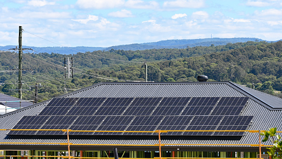 Solar panels near industrial plant