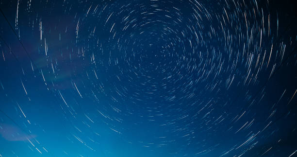 istock Night Starry Sky. Trails Of Stars Rotate. Dawn Is Co 2095945548