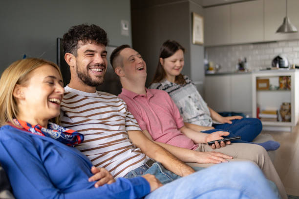 istock Cheerful diverse couples watching a comedy film at home. 2095969223