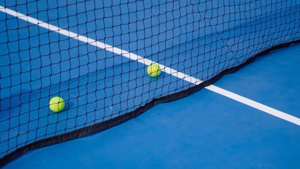 istock Tennis ball and net tennis 2095972425
