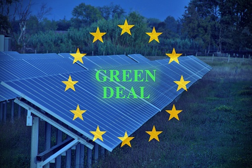 European flag in green with green deal written in the center. The european green deal will be the socioeconomic foundation for the further development of the european union in the 21st century.