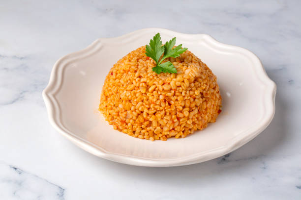 istock Traditional turkish bulgur pilaf with tomato sause in plate (Turkish name; meyhane pilavi) 2095993899