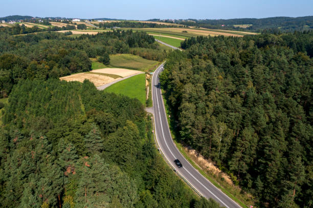 istock Winding road and forest, aerial view 2096016534