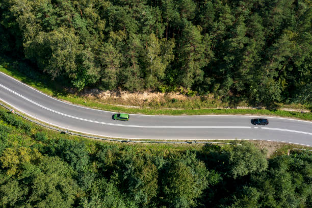 istock Road through a forest, aerial view 2096025167