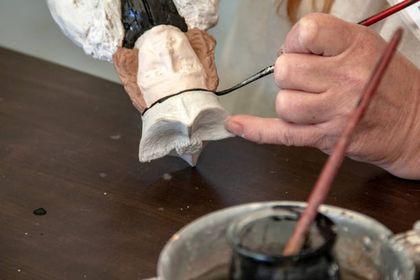 istock Painting on wooden statuette 2096036189
