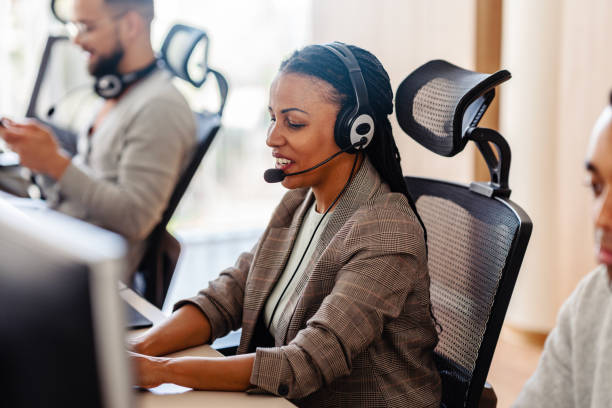 istock Multiethnic group of IT profesionals working togeter using computers in their office 2096046370