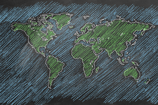 World map hand drawn in chalk. Sketch on a blackboard.