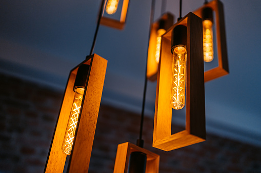 Modern lights hanging from the celling indoors.