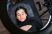 Female Client Lying With A Plastic Cover On Her Eyebrows At A Beauty Salon