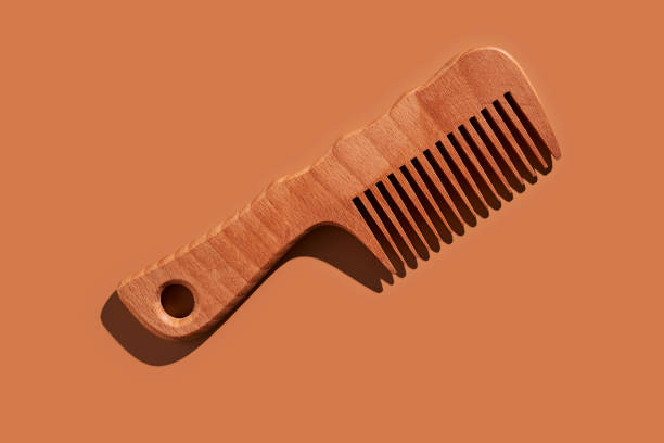 istock Wooden comb on a beige background. 2096068411