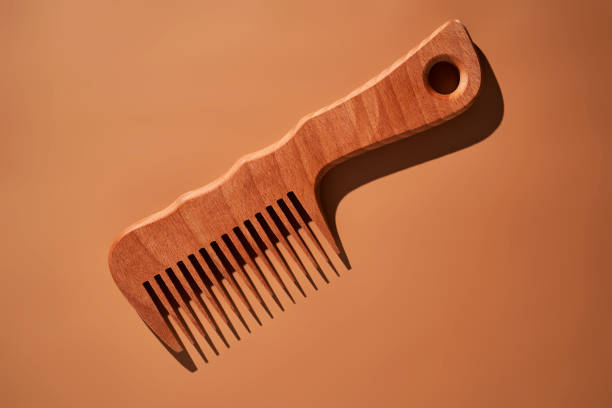 istock Wooden comb on a beige background. 2096070033
