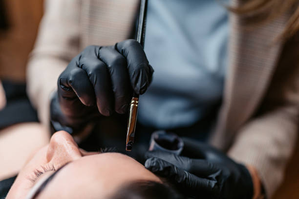 istock Female Beautician Microblading Her Client's Eyebrows At A Beauty Salon 2096071073