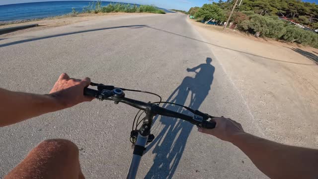 Riding a bicycle by the sea