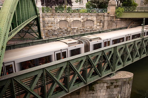 Subway train moving over the railway bridge in Vienna, Austria.