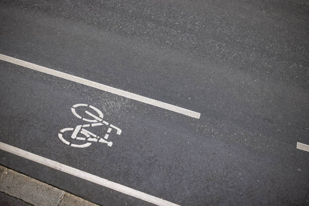 Separate bicycle lane for bicycles on the city street. White painted bike on asphalt.