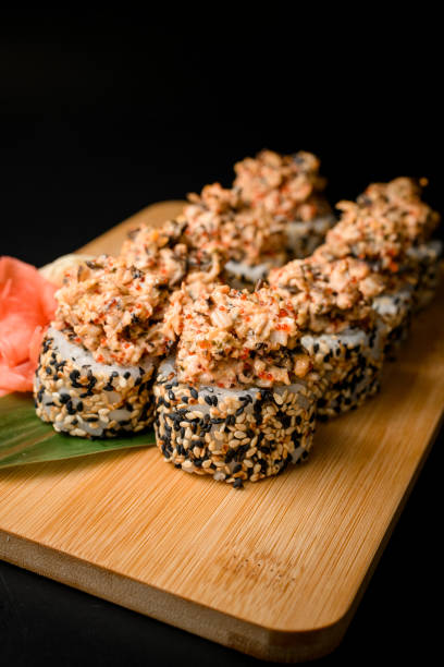 istock Set of rolls with red fish, sesame and caviar on a green leaf 2096101754