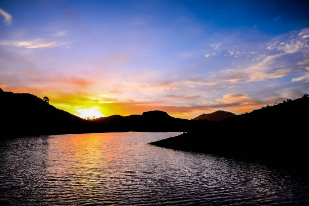 orange sun setting - image alternative energy canary islands color image - fotografias e filmes do acervo