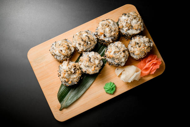 istock Set of a rolls wrapped in rice with sesame on a dark background 2096110662