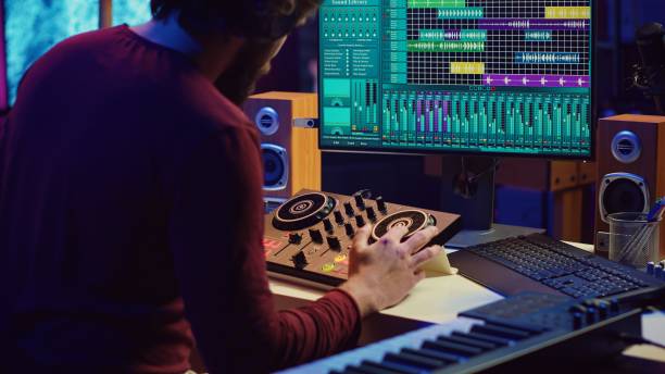 istock Audio engineer inserting an usb stick in the pc to record himself playing piano 2096112944