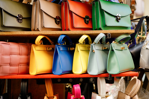 Close up of different leather bags on market