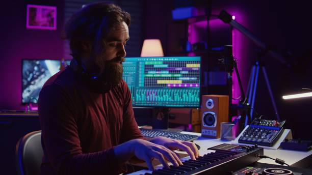 istock Audio engineer doing recording session with piano keyboard in home studio 2096128364