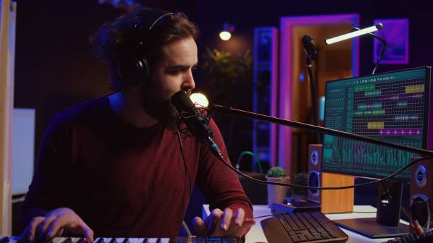 istock Songwriter recording a new song with microphone and midi controller 2096137424