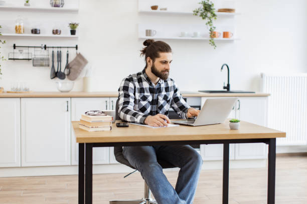 istock Businessman with pen making notes on draft of paper document. 2096141157