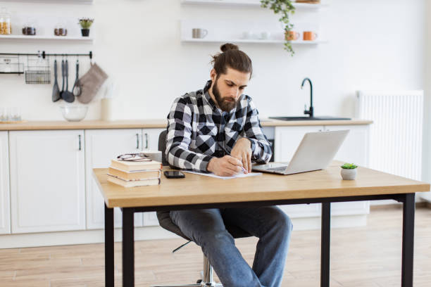 istock Businessman with pen making notes on draft of paper document. 2096141160