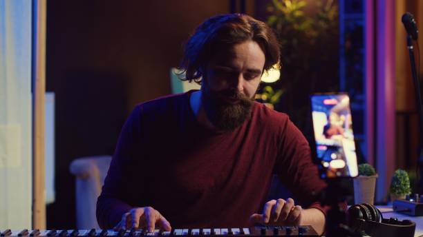 istock Artist teaching online piano lessons from his home studio 2096143394