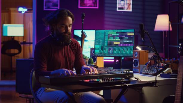 istock Sound engineer playing electronic piano keyboard and recording sounds 2096153457
