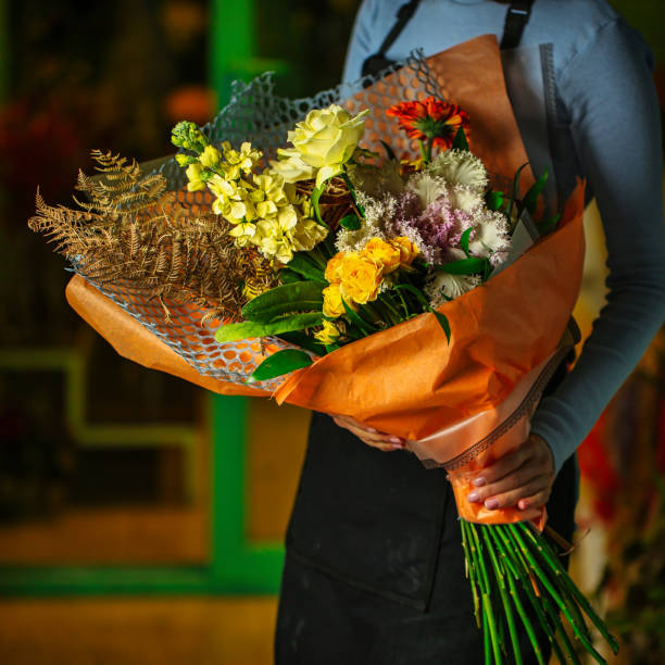 istock Man Holding Bouquet of Flowers 2096186475