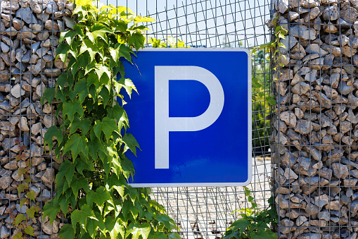 Parking sign on the background of a decorative wall