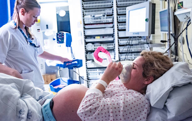 young pregnant woman in the hospital ward and ready to delivery a baby. - cesarka zdjęcia i obrazy z banku zdjęć