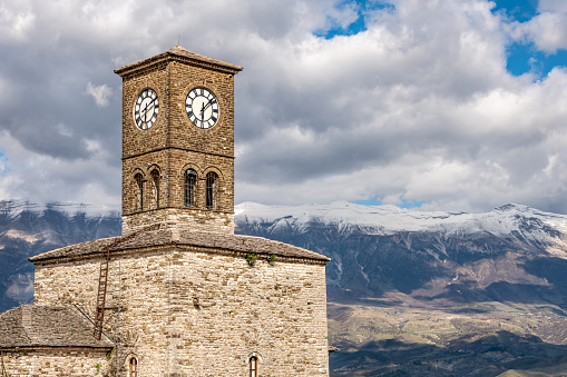 Clock Tower above Gjirokaster in Albania with Zagori Mountains in distance