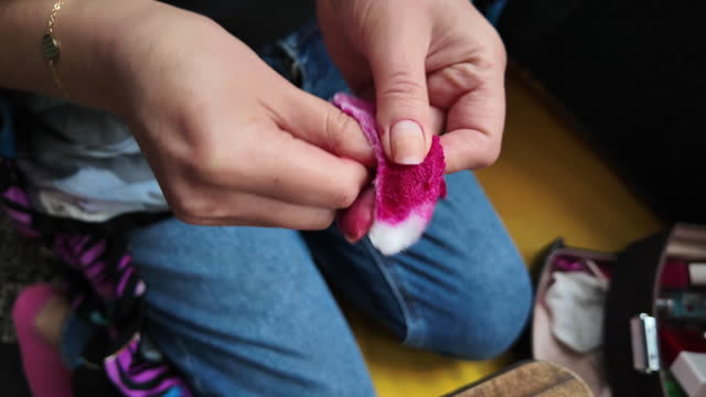 Woman Removing Nail Polish