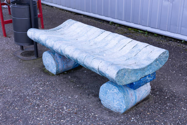A bench made from pressed used disposable shoe covers. An example of recycling plastic waste. The concept of recycling plastic waste, saving the planet from garbage, ecology..
