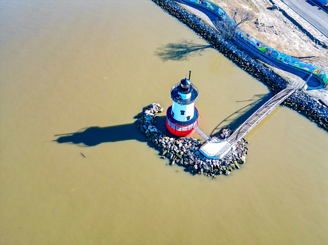 Aerial view of a lighthouse by the water's edge